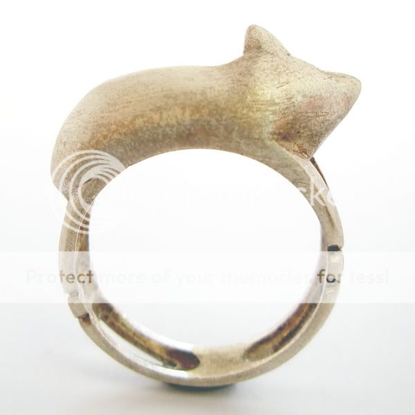 This adorable artistically detailed 14k white gold cat ring will 